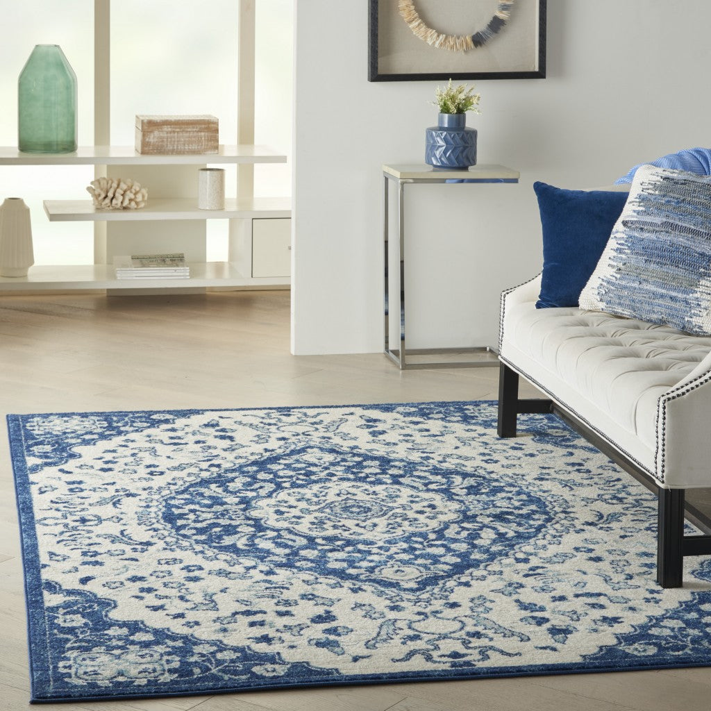 5' X 7' Blue And Ivory Power Loom Area Rug