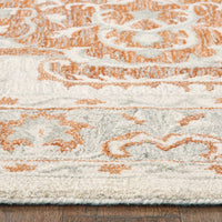 5' X 8' Orange and Ivory Medallion Area Rug